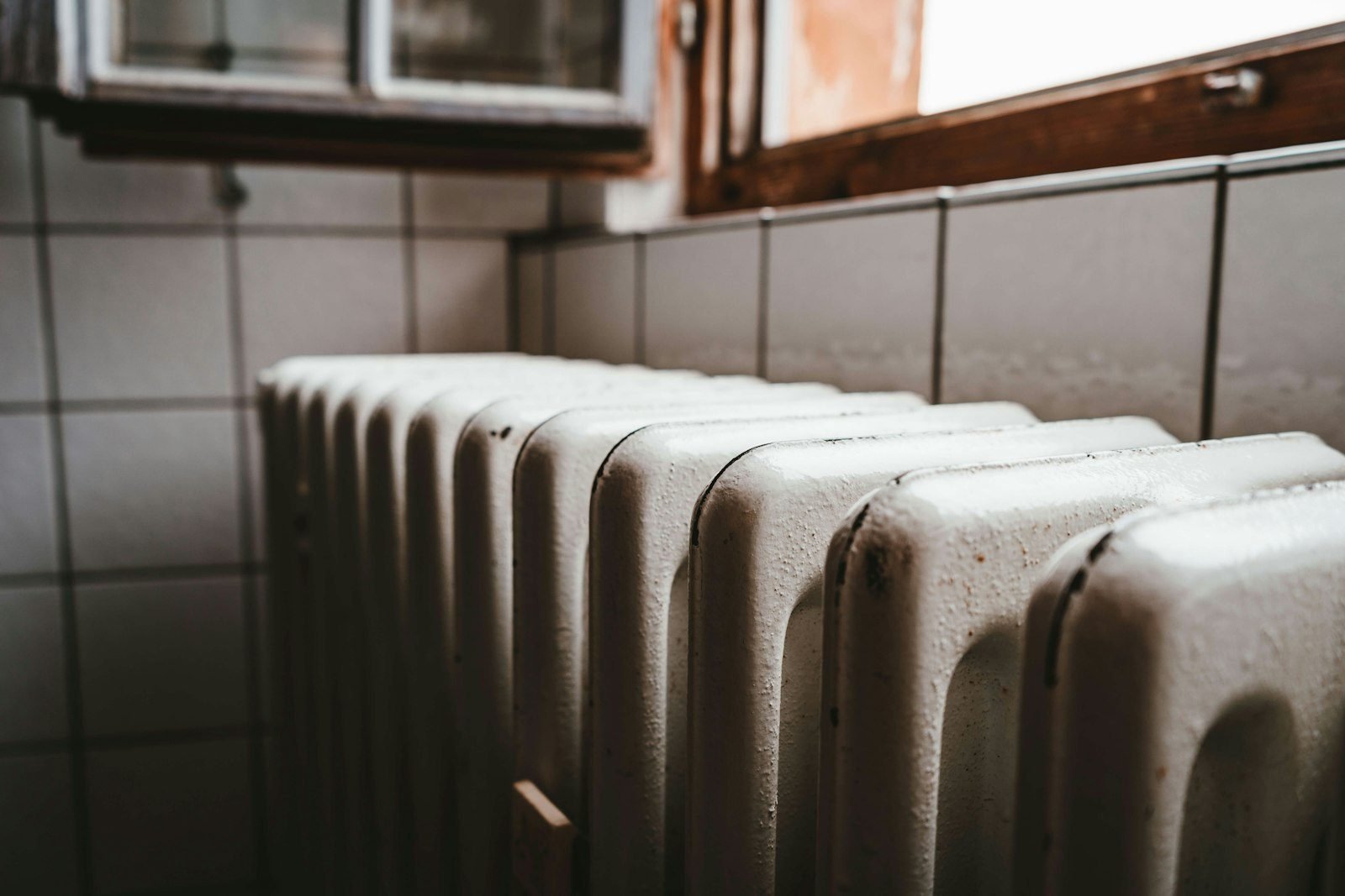 Traditional radiator beneath a window
